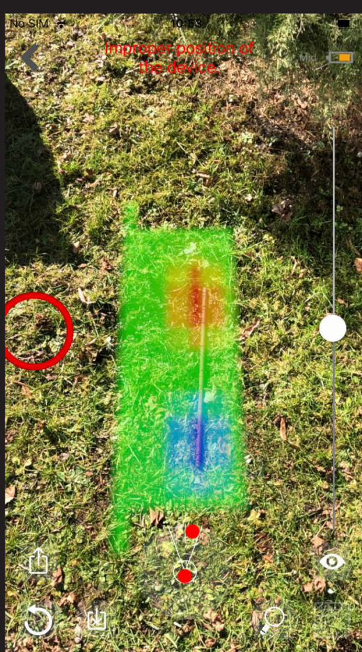 AR camera overlay of a steel rod scan — a narrow signal running from red at the top to blue at the bottom over a straight line marker